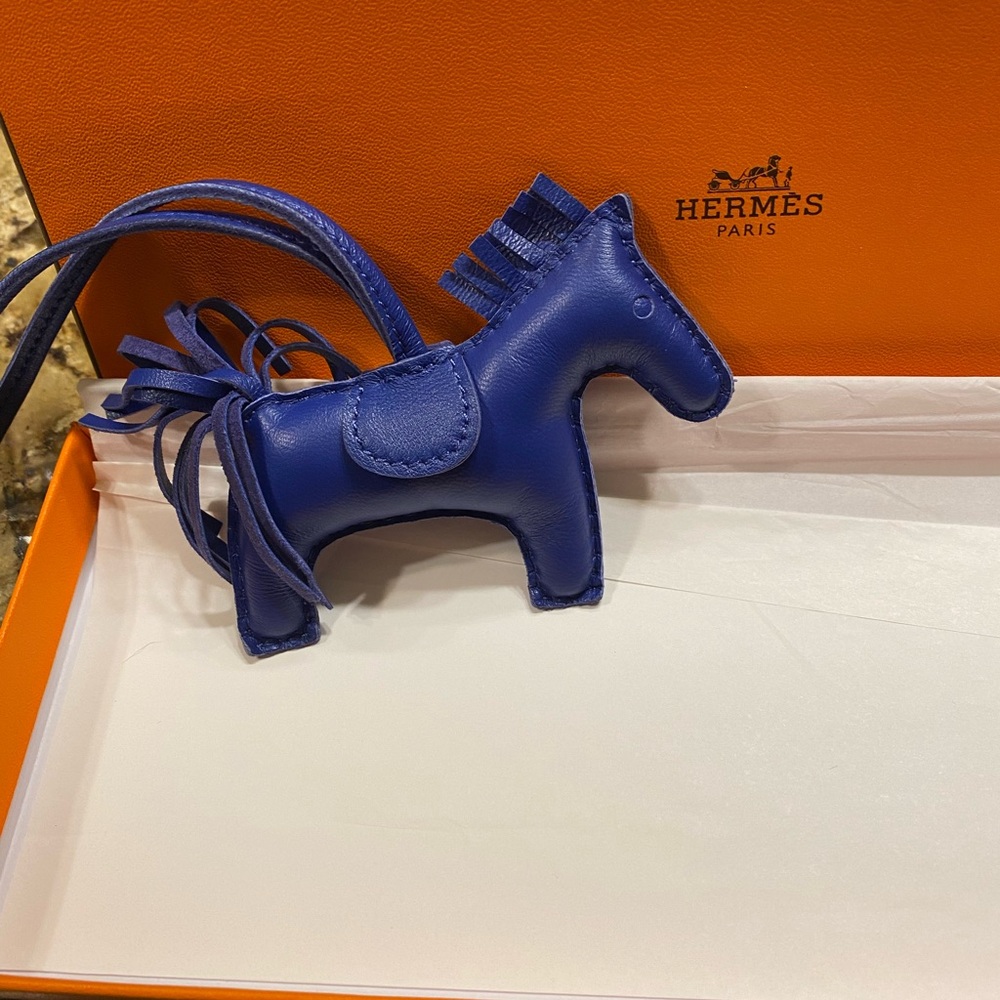 New in box Authentic Hermès Rodeo PM Charm in sapphire blue. Excellent condition